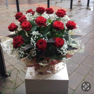 The Love Hub - 12 red roses gyp and green arrangement